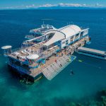 Reef Magic pontoon surrounded by blue water at Moore Reef