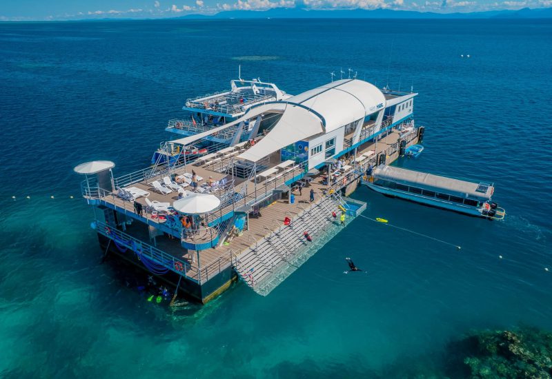 Reef Magic pontoon surrounded by blue water at Moore Reef